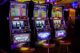 Live dealer at blackjack table with chip stacks and cards